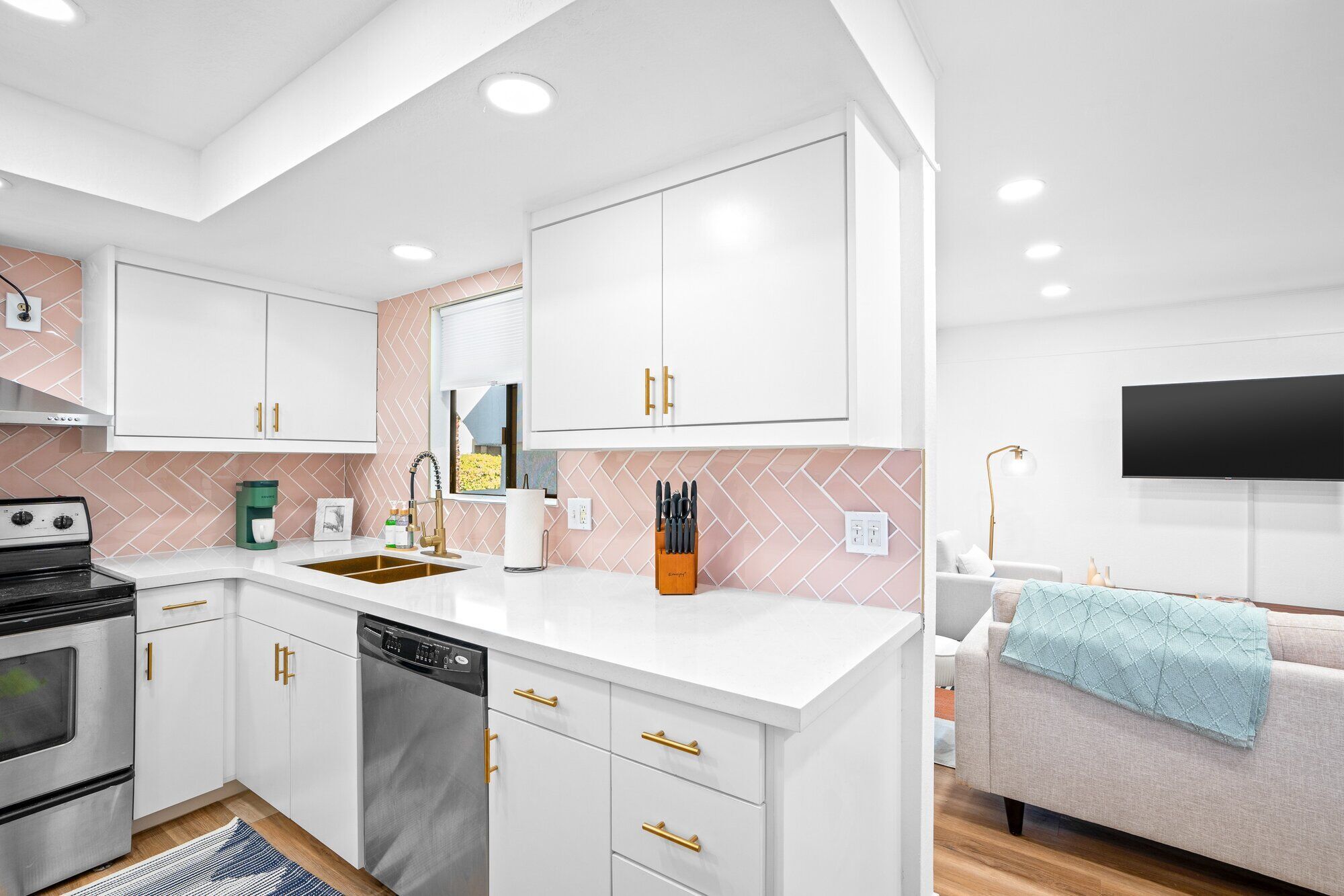 Pool deck with lounge chairs at The Sundune Palm Springs