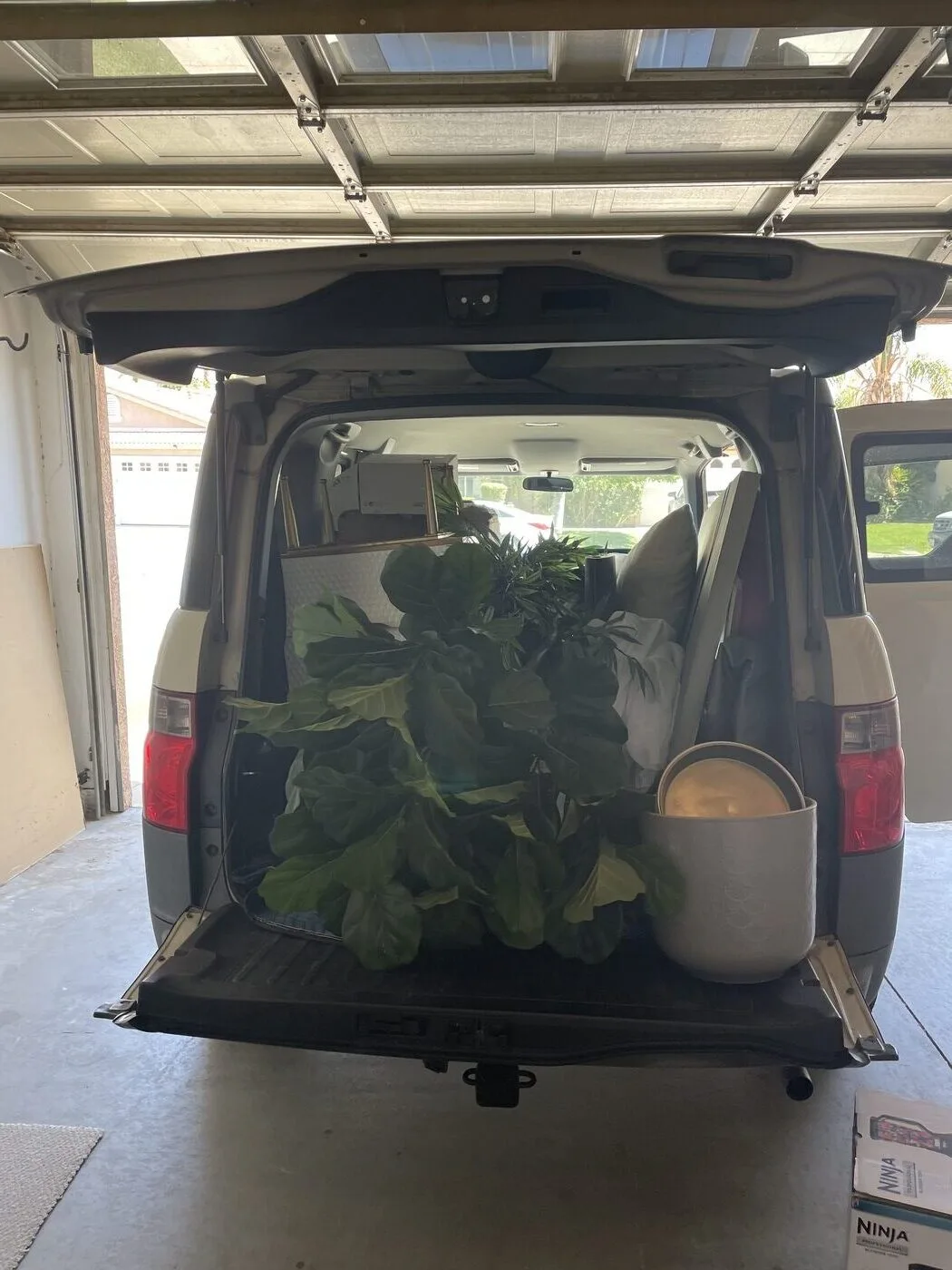 Honda Element packed with furniture and storage bins for The Cozy Cactus