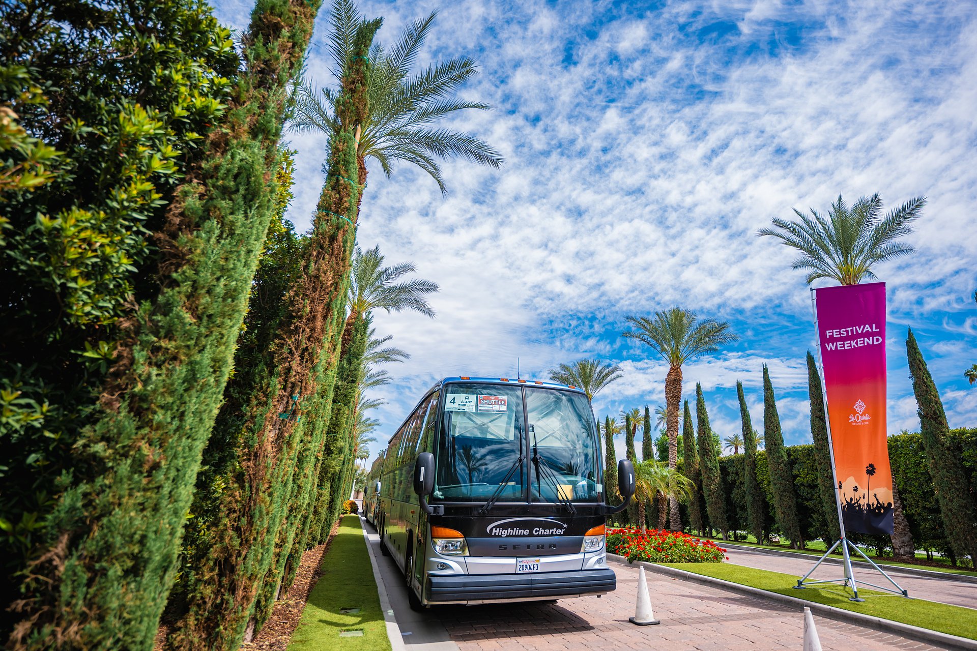 Coachella festival shuttle bus picking up attendees from Palm Springs area for transport to Empire Polo Club in Indio