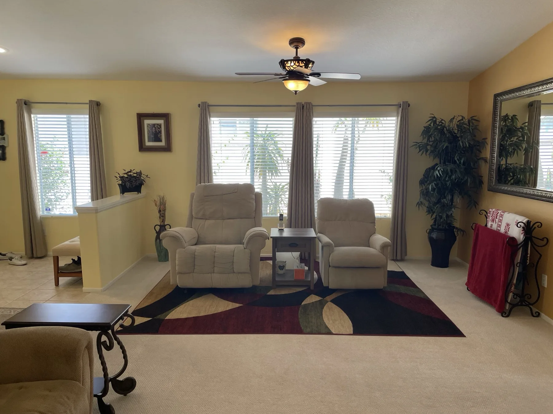 Cozy Cactus living room before renovation with traditional brown furniture Indio