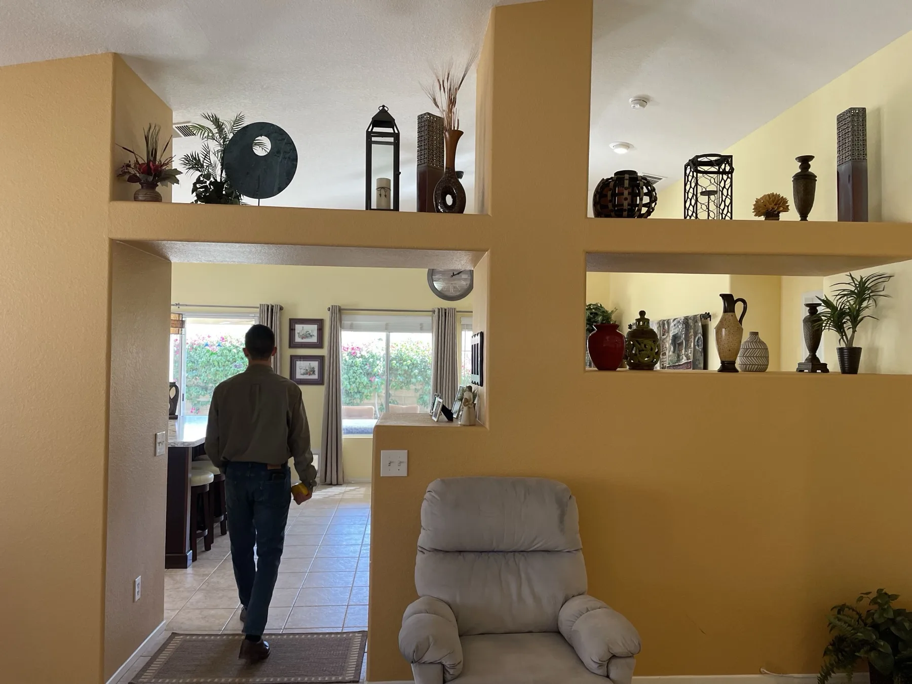 The Cozy Cactus before renovation, yellow walls and dated exterior