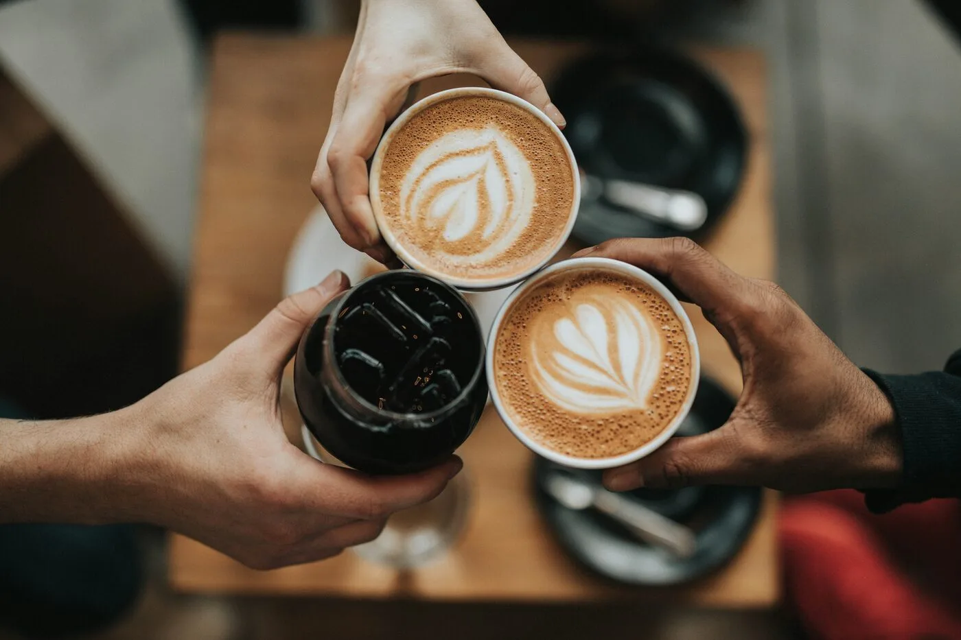 Coffee drinks on a table in a Palm Springs cafe with warm natural light