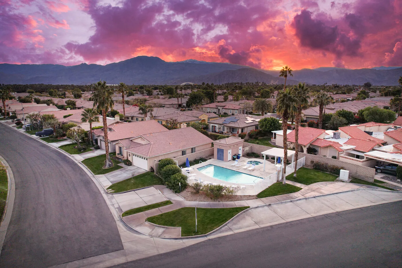 Aerial view of The Cozy Cactus vacation rental in Indio CA showing pool and backyard layout