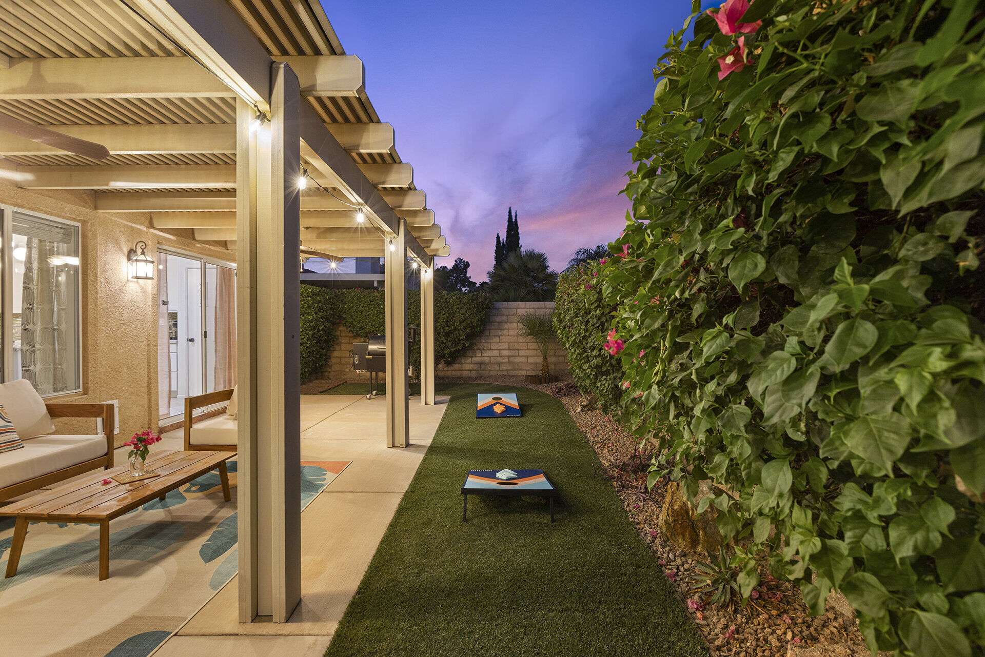 Backyard of the Cozy Cactus vacation rental in Indio California with private pool, hot tub, and desert landscaping