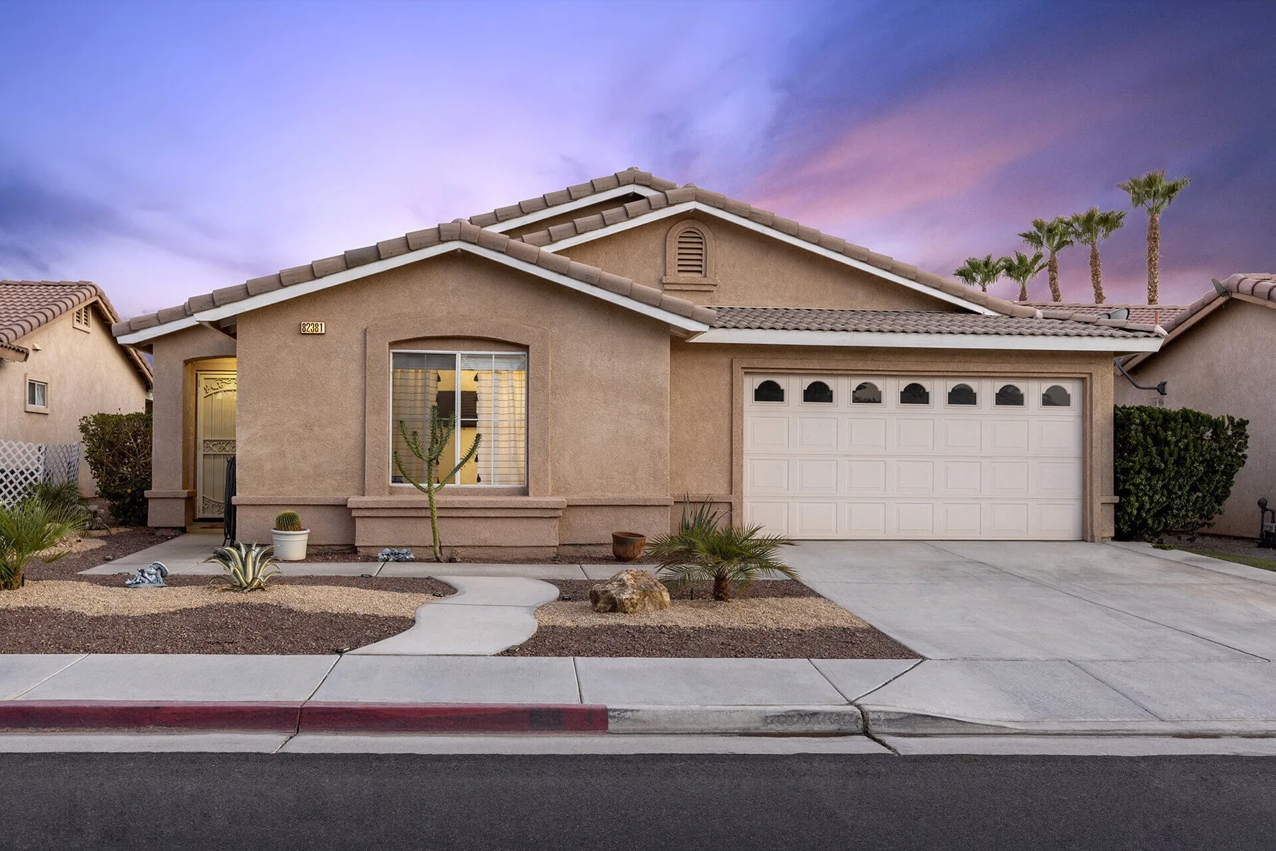 Exterior of The Cozy Cactus vacation rental in Indio CA with desert front yard
