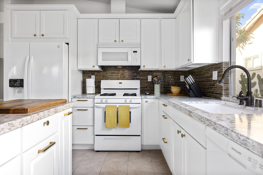 Cozy Cactus vacation rental kitchen in Indio California with family-friendly layout, labeled storage, and warm natural light