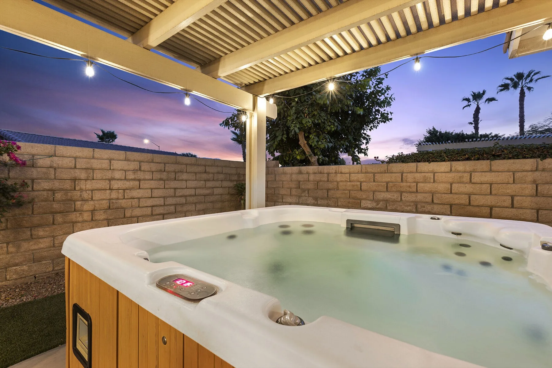Private hot tub at night at Cozy Cactus vacation rental in Indio CA