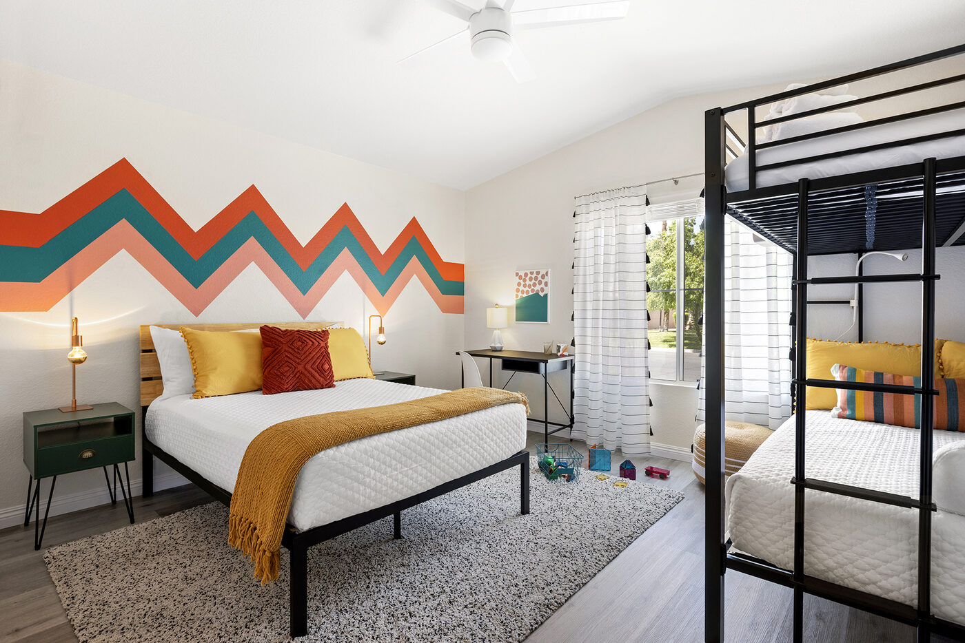 Colorful hand-painted backyard mural at The Cozy Cactus vacation rental in Indio California