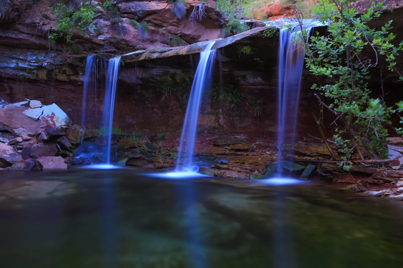 Desert waterfall dropping into a rocky canyon pool, similar to Tahquitz Falls near Palm Springs California