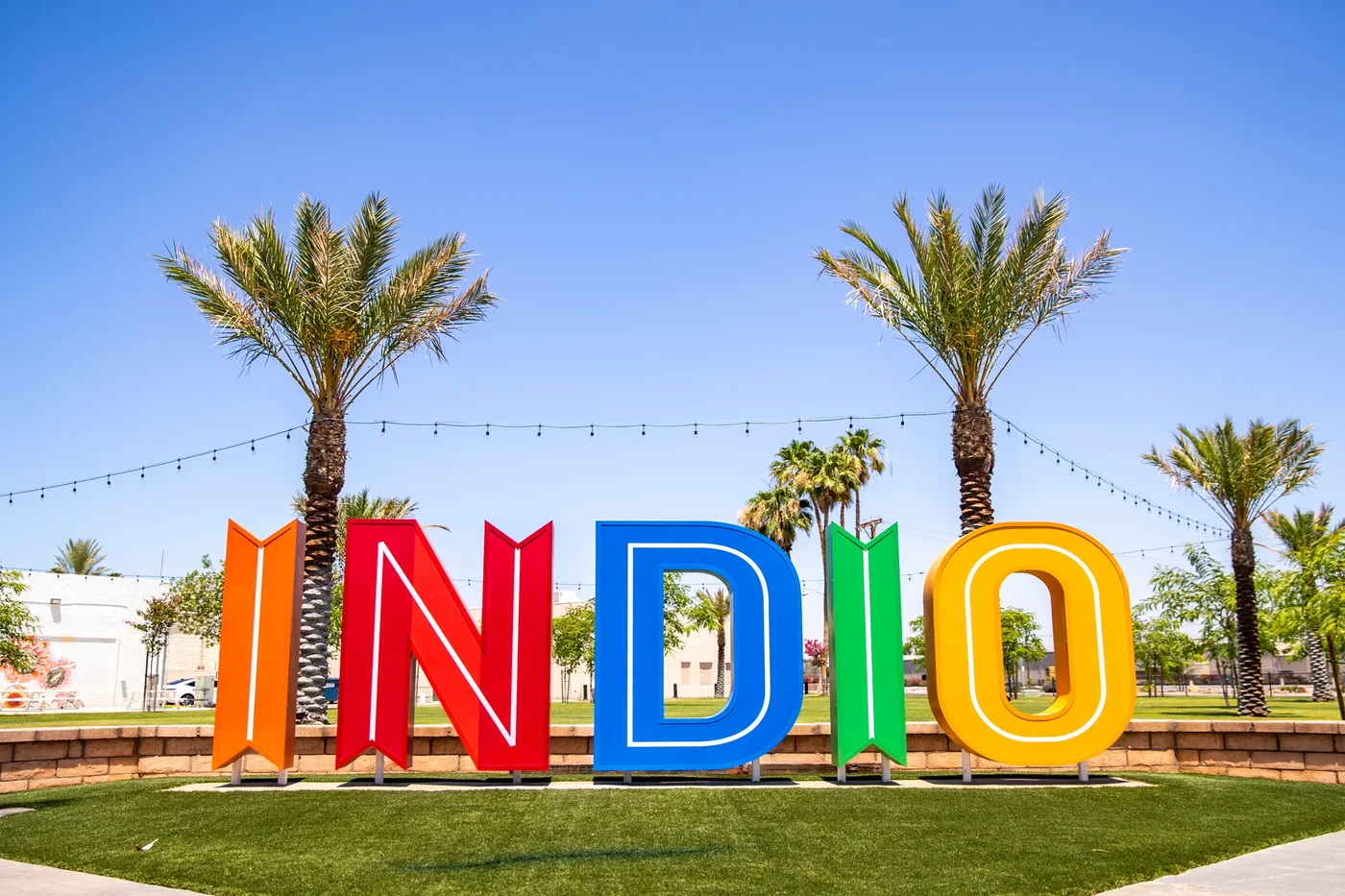 Indio city sign on Miles Avenue, near the main grocery shopping corridor for Coachella Valley vacation rentals