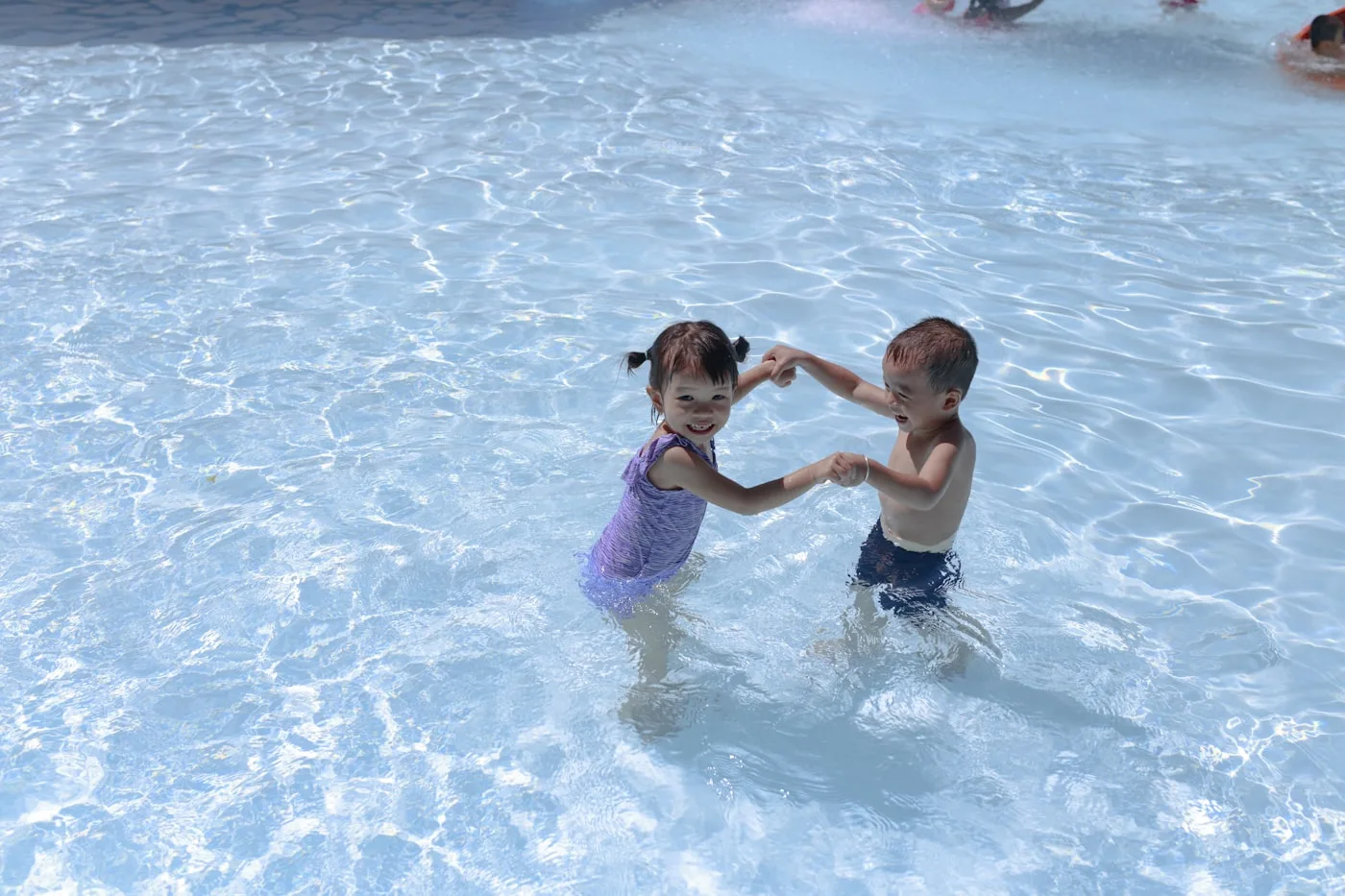 Family enjoying a Palm Springs vacation with kids at a desert property with pool
