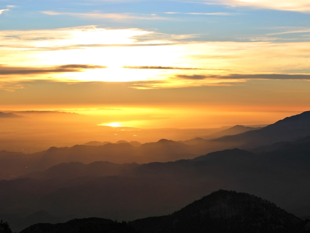 Sunrise view from the Palm Springs Aerial Tram mountain station with golden light over San Jacinto peaks