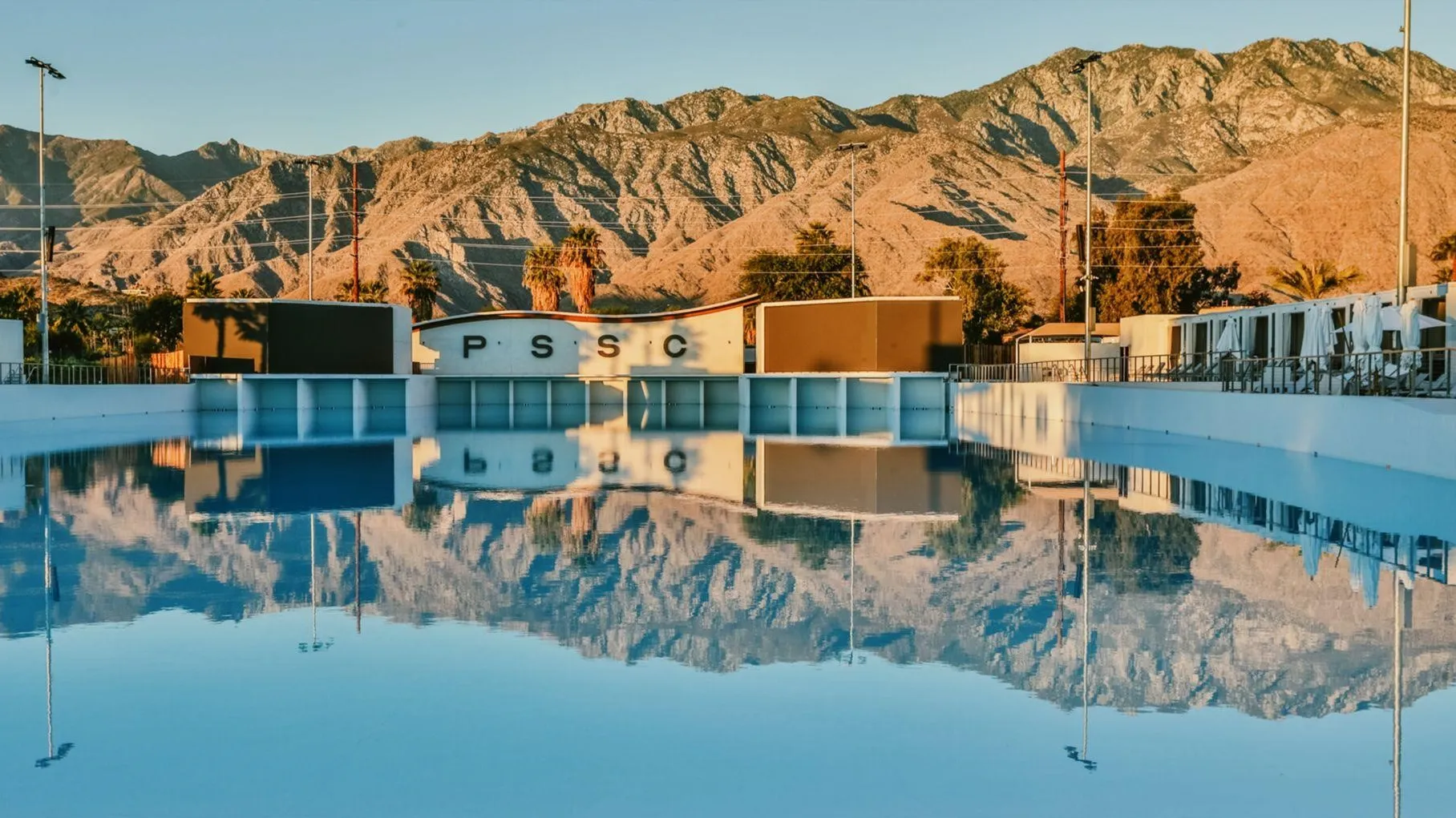 Wave pool at Palm Springs Surf Club reflecting the desert sky