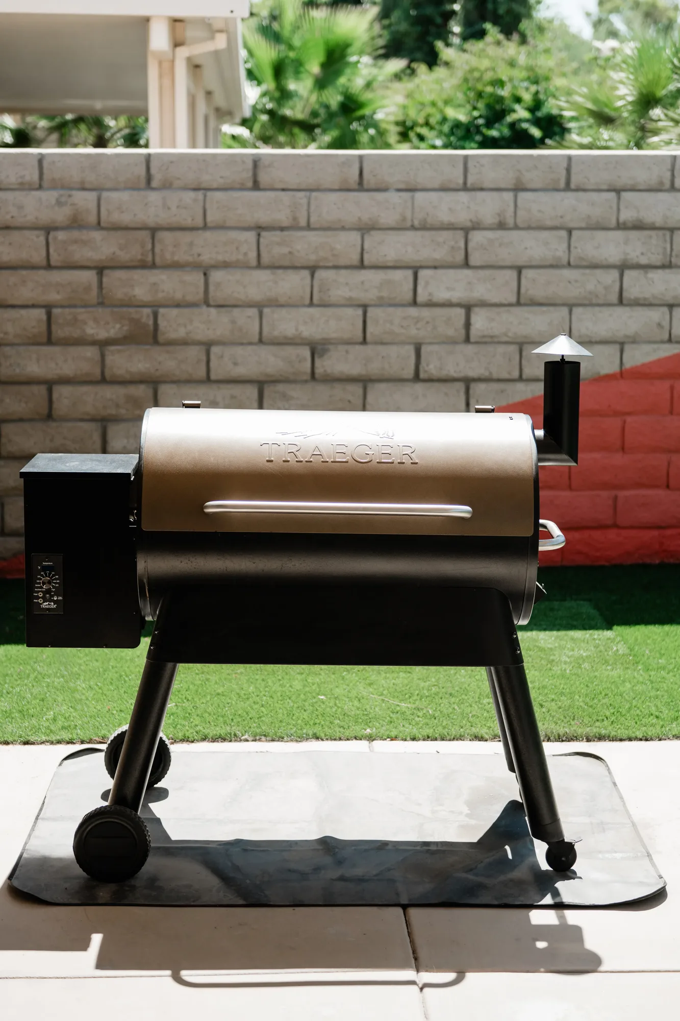 Traeger wood-pellet grill on Cozy Cactus backyard patio