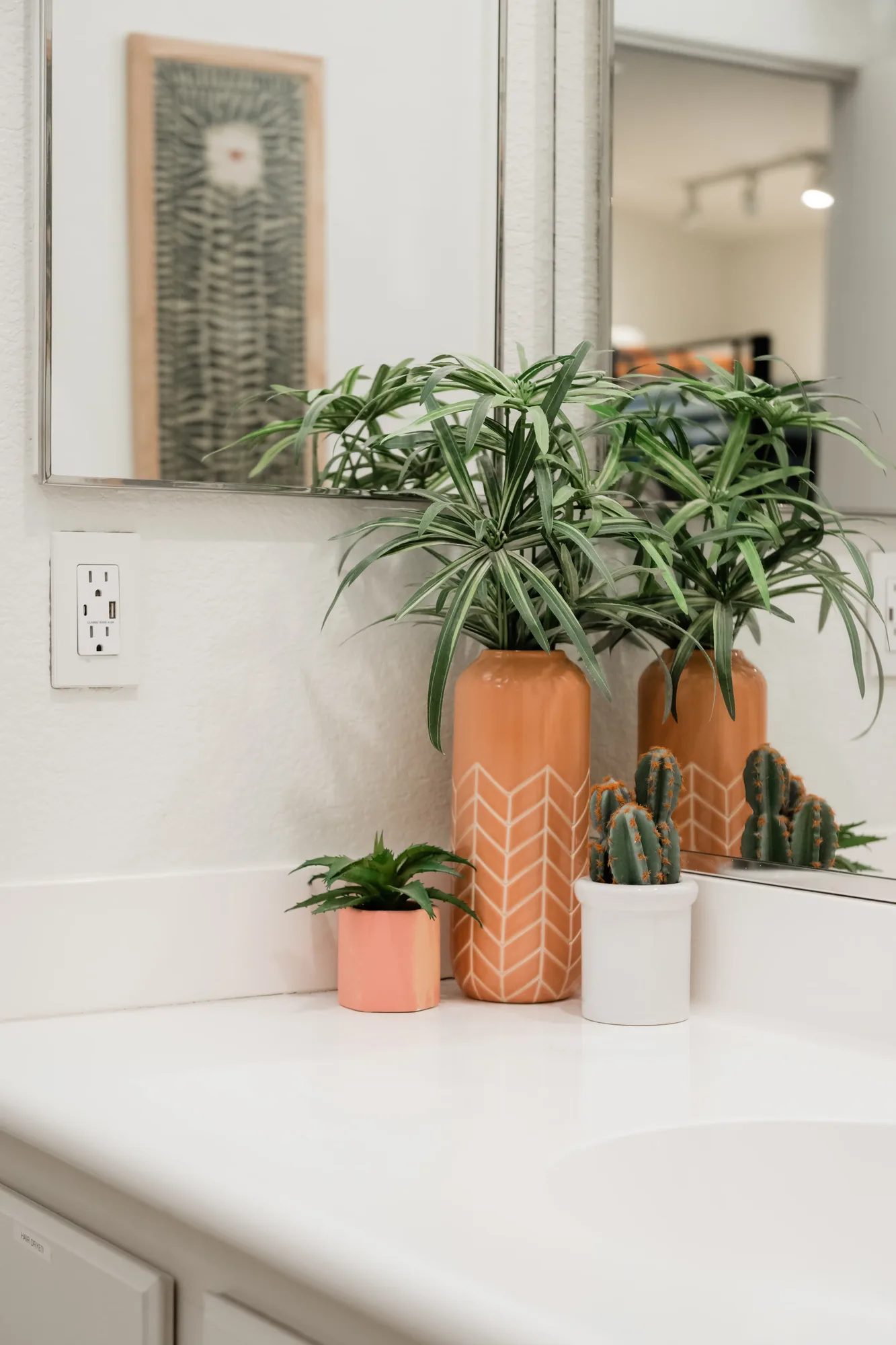 Cozy Cactus bathroom vanity with succulent styling and black fixtures