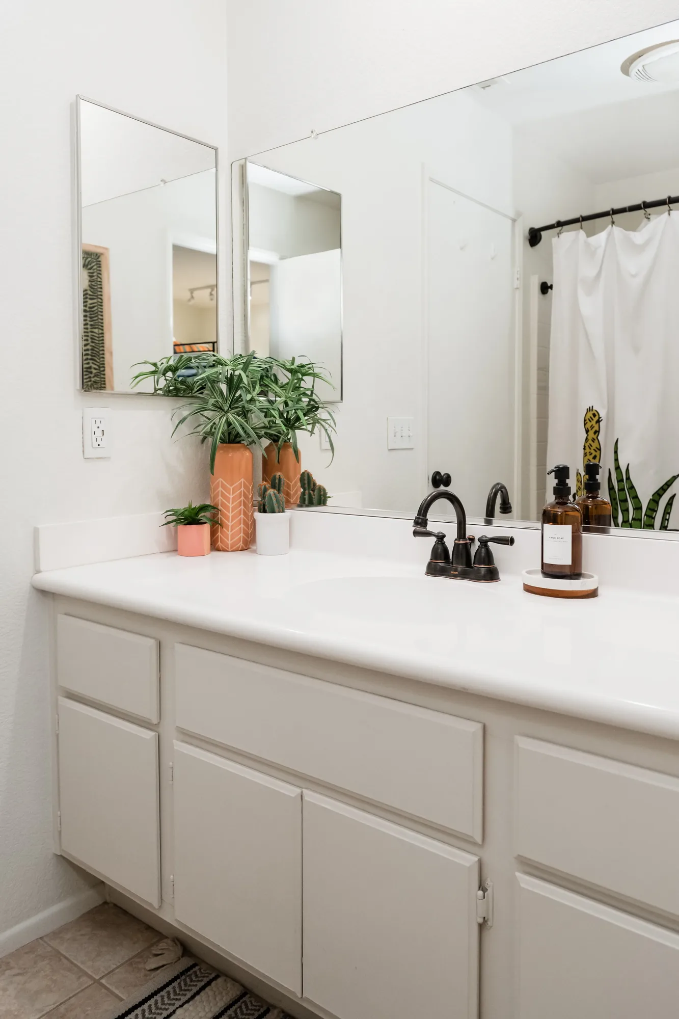 Cozy Cactus bathroom detail with terracotta floor tile and black hardware