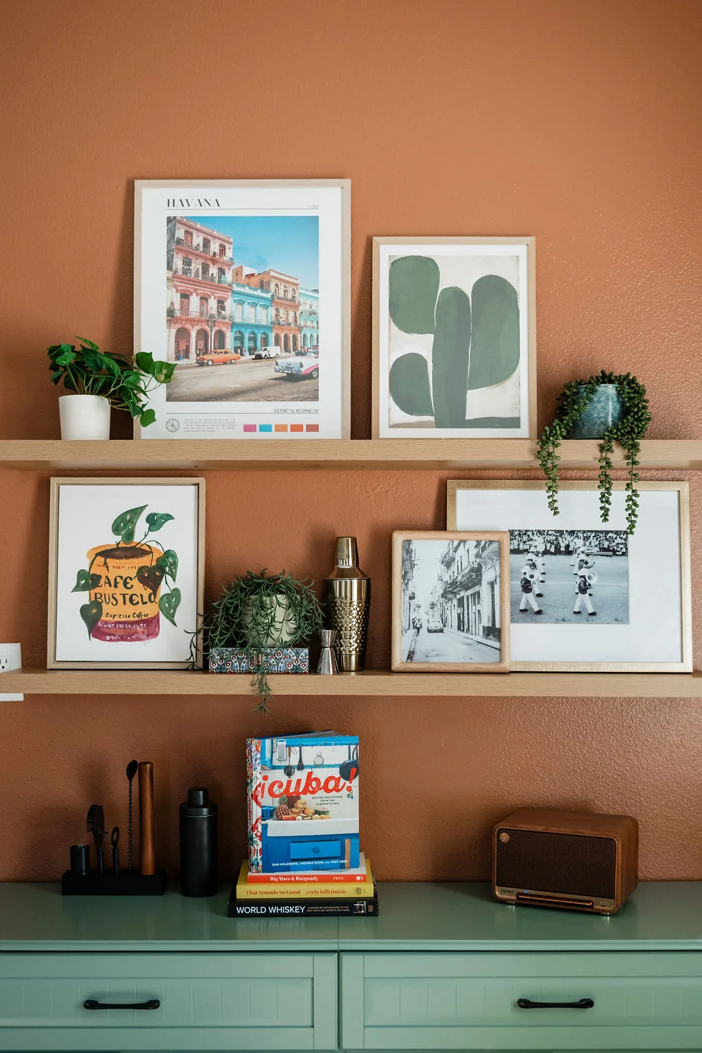 Terra Luz kitchen floating wood shelves with curated objects above geometric tile backsplash
