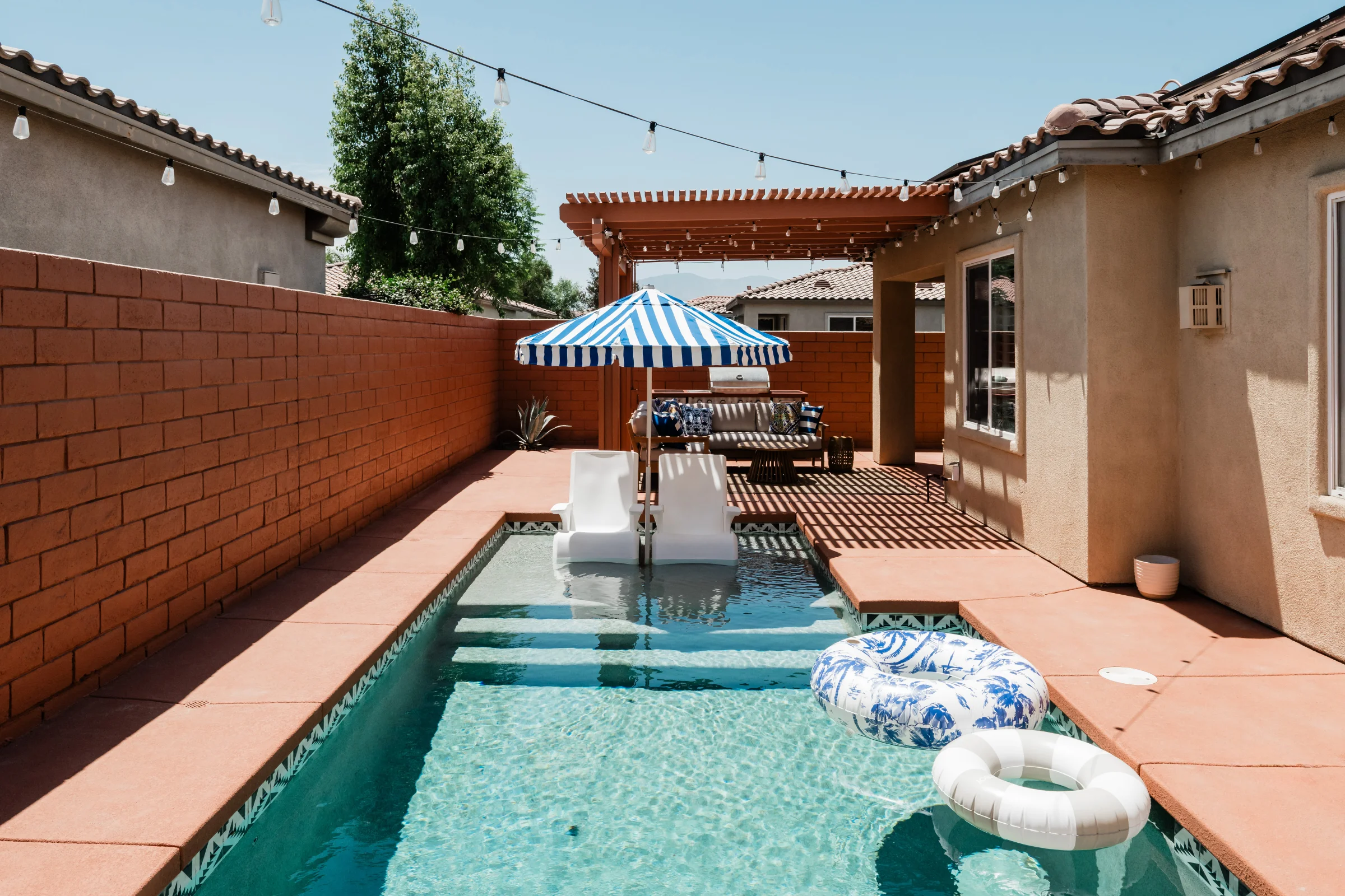Terra Luz pool from poolside angle showing Kahlo blue water and desert sky