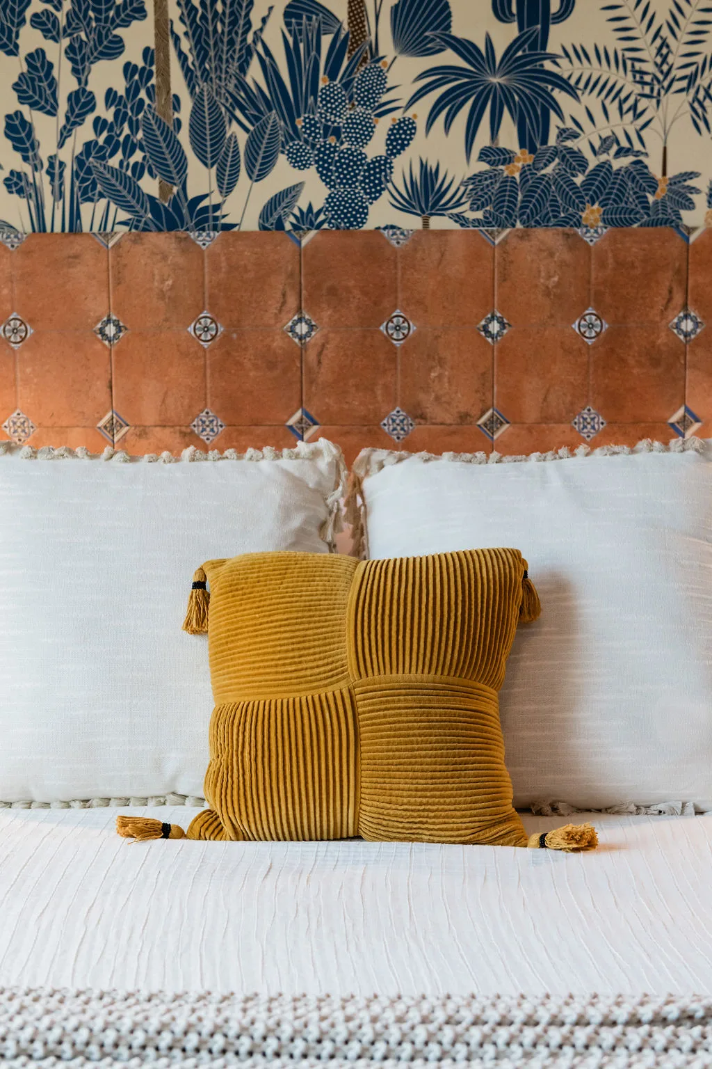Terra Luz wallpaper bedroom custom cement tile headboard with Rebel Wall tropical wallpaper