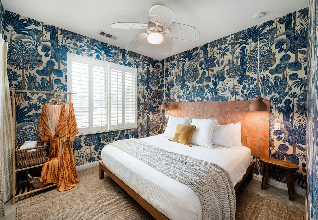 Terra Luz wallpaper bedroom seating nook detail with woven sconce and checkerboard side table