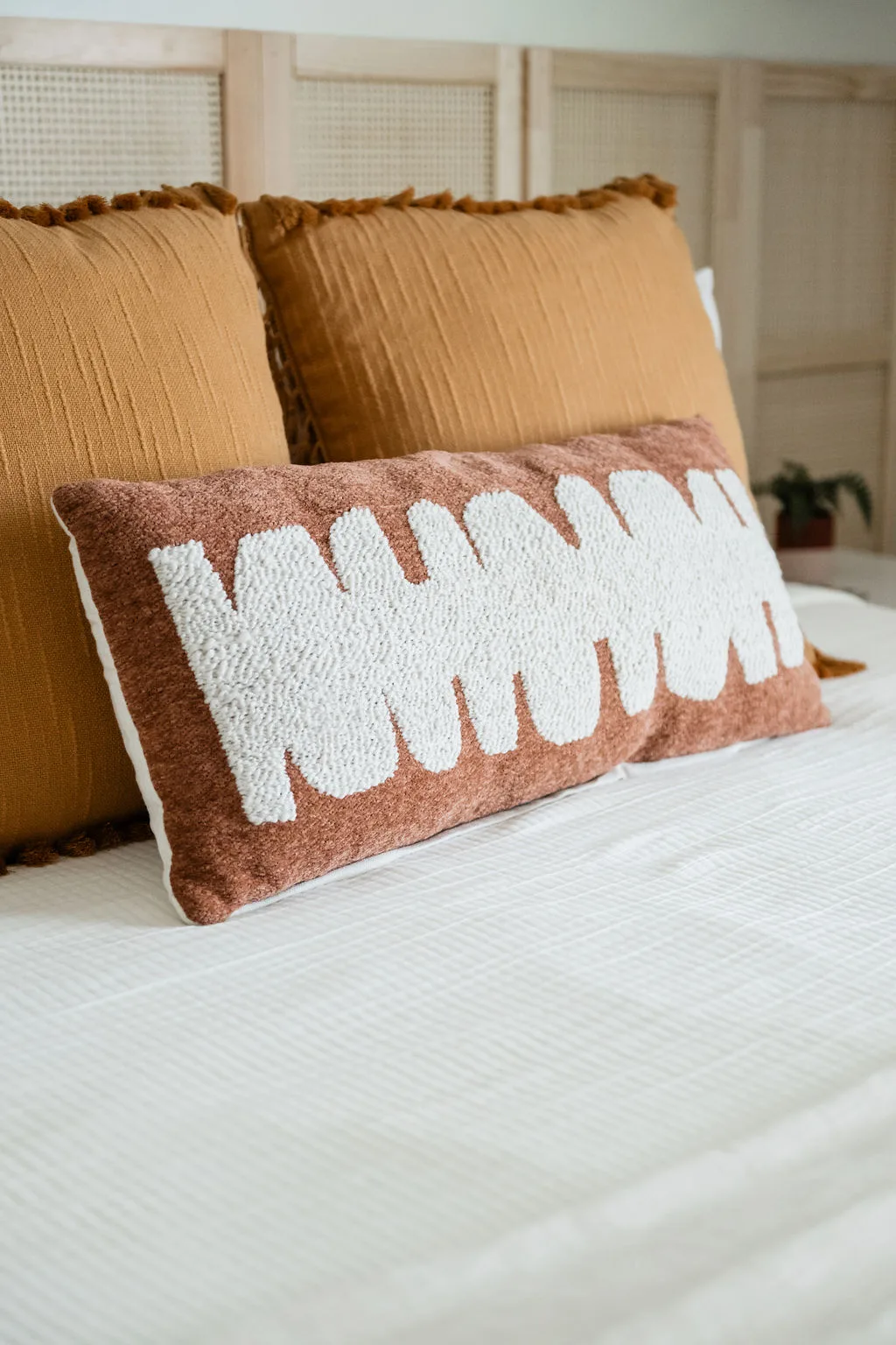 Terra Luz Cali Room queen bed with linen bedding and warm afternoon desert light
