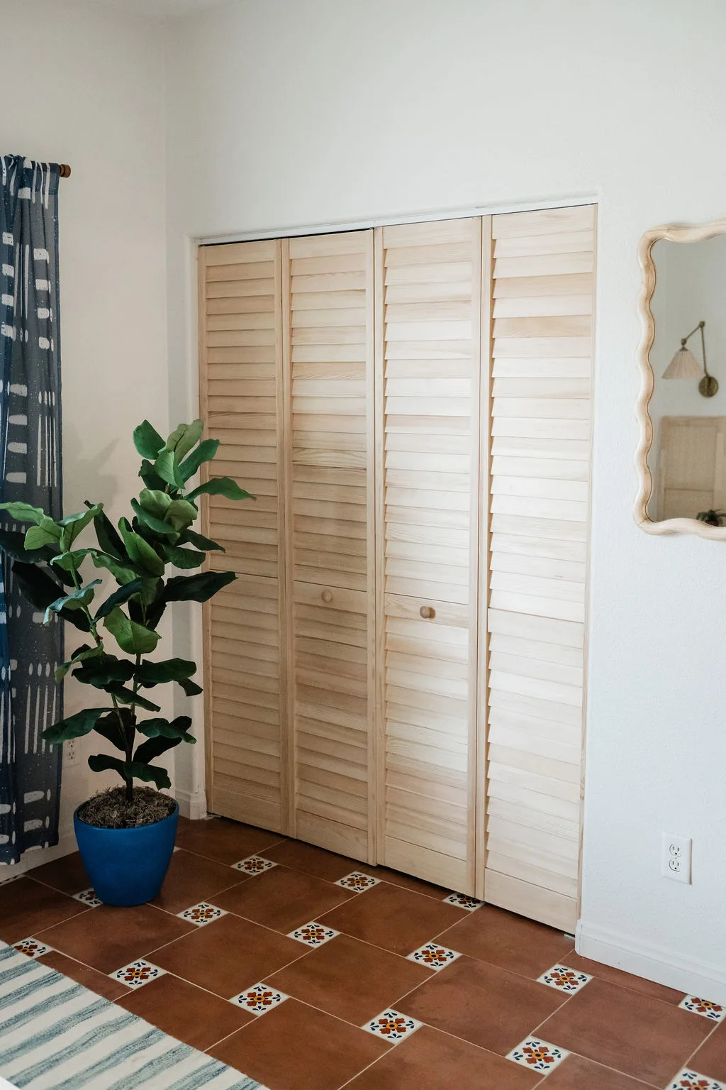 Terra Luz third bedroom styled with warm sand and rust color palette