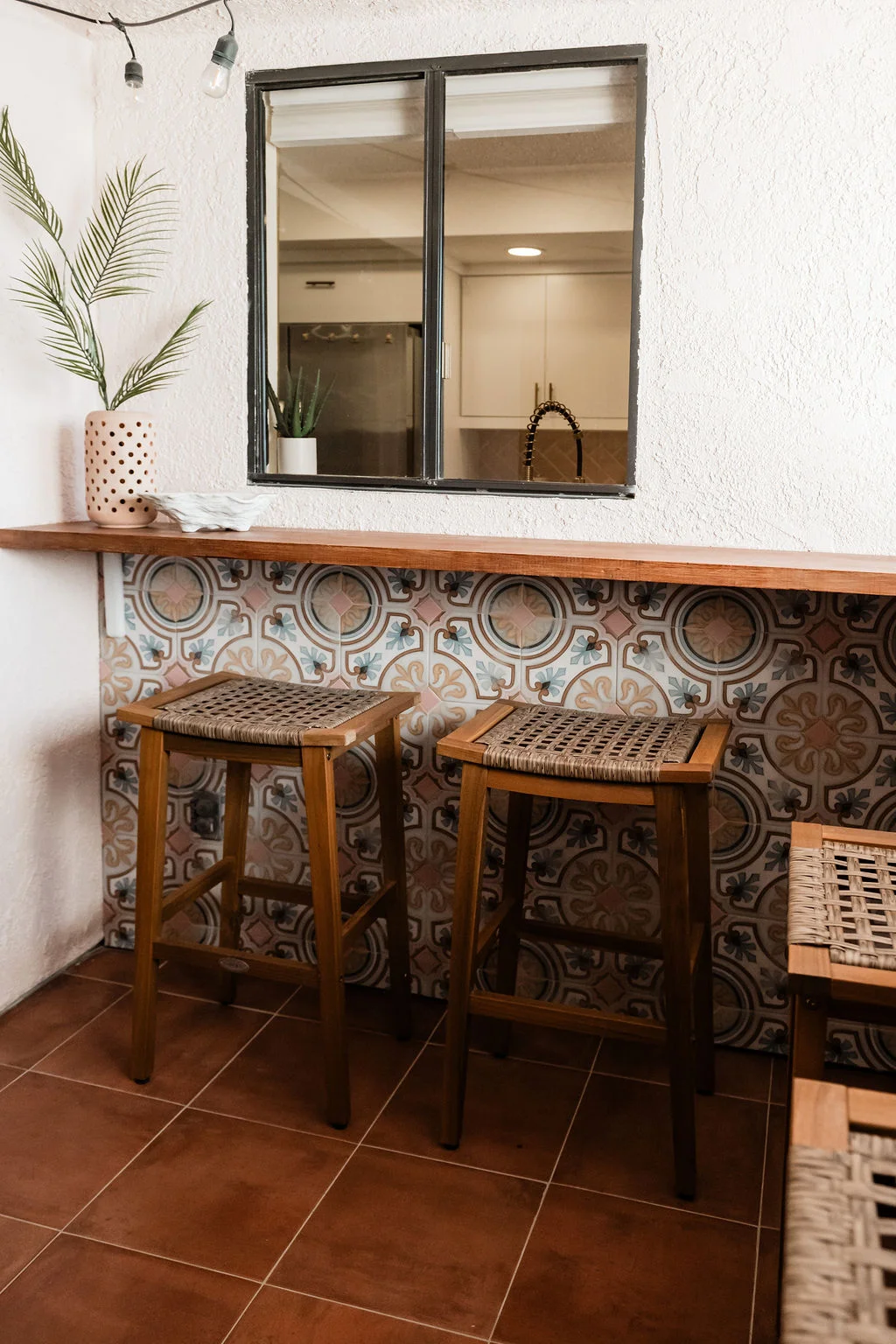 The Sundune Palm Springs private balcony cement tile bar counter with bar stools and pass-through window